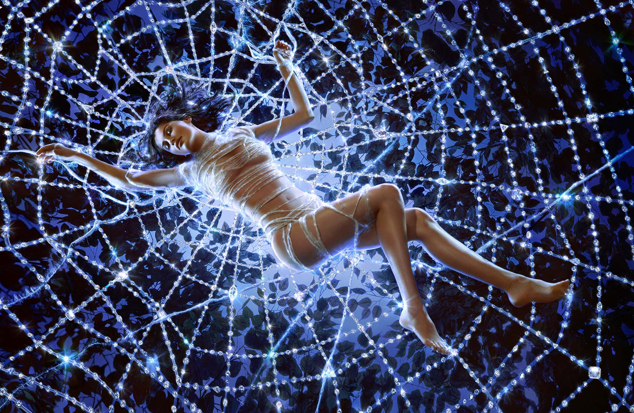 Cover image: In order to suspend French model Laetita Casta for this advertising shoot for diamond.com in a life size “spyder net”, high above a 4×6′ Broncolor Cumulite, itself rigged up on 2 massive crank stands, this set required a great amount of solid and reliable grip. Any failure of the equipment would have resulted in catastrophe. (image by Markus Klinko).
